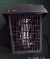 Front view showing the protective grid and light tube inside the bug killer unit.