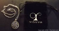 Photo of Celtic knot pendant necklace beside black cloth pouch with YISUYA logo.