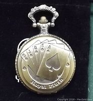 Front of pocket watch showing bronze color with embossed Royal Flush playing card design