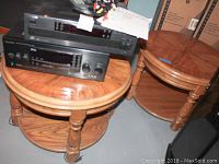 Pair of two wood double level round occasional tables with equipment on top showing size and design