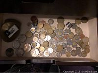 Drawer containing mixed Canadian and US coins