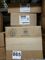 Stacked boxes labeled Da-Lite articulating mounts, model and lot label visible