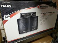 Box front showing Harbinger HA60 4-Channel 60-Watt PA System with image of speakers and mixer.