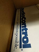 Photo showing the Audiocontrol branded packaging box inside a larger shipping box.