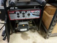 Front control panel with four AC outlets and Coleman Powermate 5500 decal