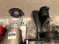 Wide shot showing Cuisinart blender, burr mill box, Keurig machine with K-Cups, and Dessert Bullet.