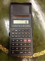 Front view of Casio fx-260 scientific calculator powered by solar energy, displaying zero on the screen.
