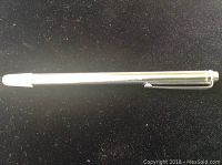 Closed telescopic pointer showing compact size, silver metal body with white tip and clip.