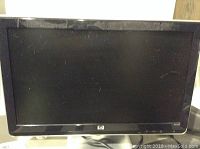 Front view of HP ET2010 20 inch monitor showing screen and bezel with scratches.