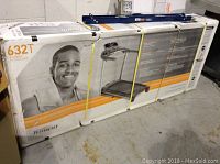 Sealed Tempo Fitness 632T treadmill in original cardboard packaging strapped with yellow bands