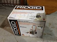 Boxed Ridgid gas pressure washer showing model specifications