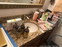 Overview showing four Purador shampoo bottles on left and various Mary Kay and Dermal products on countertop