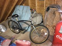 Front and side view of the black Schwinn California beach cruiser bike showing frame, tires, saddle, and handlebars.