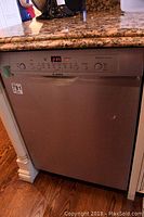 Front view of Bosch dishwasher installed under countertop