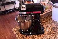 Front view of mixer mounted on countertop with bowl attached
