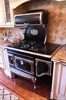 Full front view of the Elmira Designer Stove showing cooktop and oven