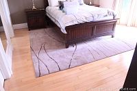 Front angle showing full rug under bed and overall pattern