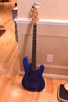 Full length front view of Epiphone bass guitar showing blue painted body, neck, and headstock with tuning pegs.