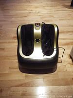 Front top view of Technomedic foot massager on wood floor