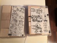Four wood-mounted medium-sized rubber stamps in plastic cases showing black and white printed designs of Halloween themed characters and phrase 'Happy Boo to You!', as well as other creatures.