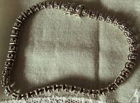 Full view of vintage sterling silver link bracelet laid flat showing entire length and clasp.