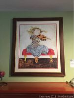 Straight-on view of framed violinist print showing full artwork and frame.