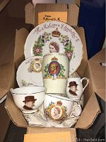 Photo shows the full set including teacups, saucers, cookie plates, Edward VIII vase, and Churchill creamer and sugar bowl in a box.