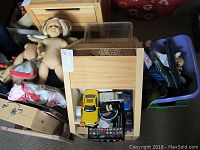 Bin with three American Girl dolls, wooden dollhouse and other accessories