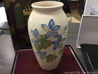 Front view of the vase showing the blue floral pattern and shape.