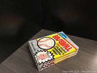 Front view of three unopened packs of 1989 Fleer baseball cards. The packs show the colorful design with baseball graphics and promotional texts.