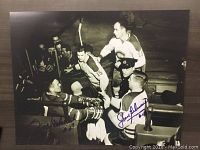 Black and white vintage hockey print showing Jean Beliveau and Frank Mahovlich with facsimile autographs on the print.