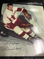 Vintage 16x20 color print of Gordie Howe in hockey gear with a facsimile autograph in the lower left corner.