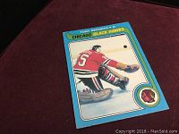 Front of 1979 Tony Esposito hockey card showing player in goalie stance for Chicago Black Hawks