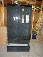 Full front view of the cabinet showing both doors and bottom drawer open.