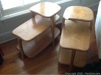 Two Heywood Wakefield wood side tables side by side by window, showing overall condition and design