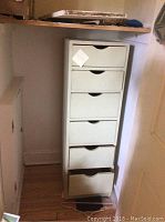 Front view of the green painted cabinet with six drawers showing size and drawer detail.