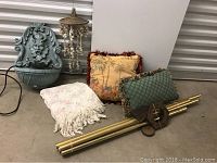 All items grouped together showing water fountain, wind chime, pillows, throw blanket, and hanging shell decoration.