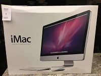 Outer packaging showing “iMac 27-inch LED 16:9 widescreen computer” labeling