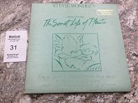 Front of the album cover showing title, artist name, design, and Braille embossing