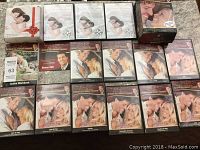 Full view showing multiple DVDs and workbooks from Anthony Robbins' Relationship Building Program spread out on a surface.