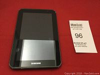 Front view of Samsung tablet showing black screen with Samsung branding and physical home button