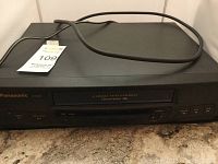 Front view of Panasonic 4 Head VCR with power cord, showing the model and front control panel.