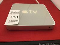 Top view of Apple TV box showing Apple logo and 'tv' branding.