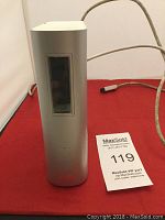 Front view of a silver Western Digital external hard drive enclosure showing vertical window panel and power cable.