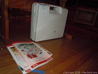 Case upright with handle and manuals in front