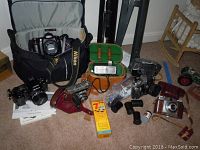 Overview of cameras, cases, Nikon bag, film packs, extension tubes and tripods
