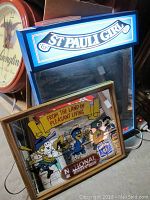 St. Pauli Girl illuminated mirror sign and National Bohemian Beer mirror displayed together