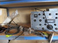 Overview shot including receiver and antenna rods on shelf