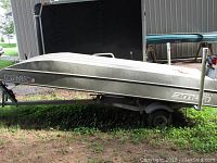 Right-side hull view upside-down on trailer frame