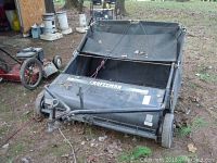 Overall view of Craftsman leaf collector on ground showing collection bag and metal frame with wheels.